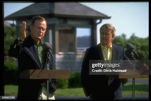 Pres. Bush & Canadian PM Mulroney informally mtg. Press outside, casually clad for vacationing despite escalating gulf crisis.