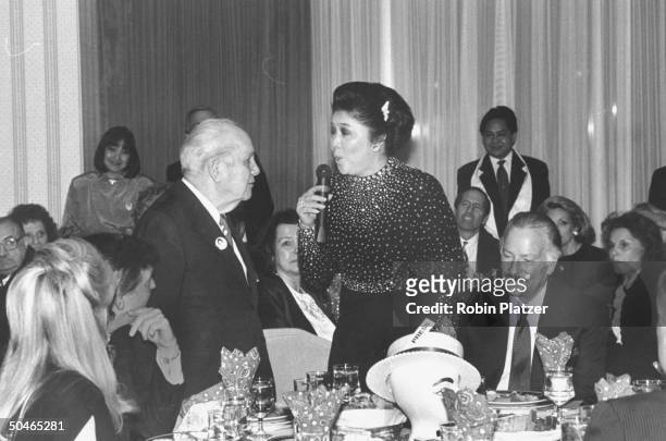 Former Philippine First Lady Imelda Marcos singing Happy Birthday to 80-year-old columnist Joey Adams at his party; part. Obsc. Are Donald Trump and...