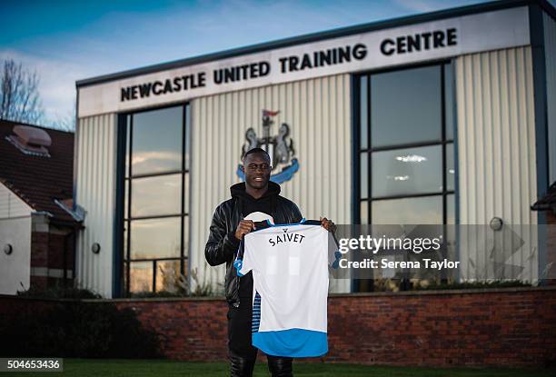 Newcastle's January signing Henri Saivet poses for photographs holding a named shirt at The Newcastle United Training Centre on January 11 in...