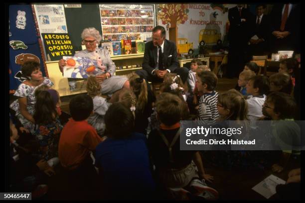 Pres. & Barbara Bush entertaining young audience, displaying artwork, imparting lesson in culture, paying classrm. Call, at elementary school in...