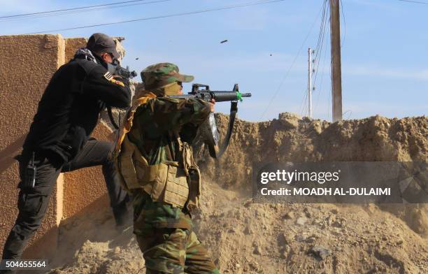 Members of the Iraqi government forces battle with Islamic State group fighters east of Ramadi, after they took control of the agricultural area...