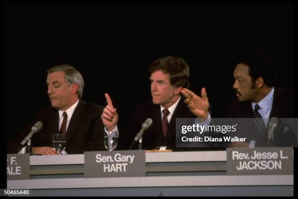 Dem. Pres. Hopefuls Rev. Jesse Jackson, Sen. Gary Hart & ex-VP Walter Mondale during seemingly contentious moment in 1 of nomination race debates.