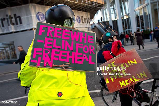 Cyclists in support of the junior doctors wear placards with the slogan "freewheelin for freehealin" outside Guy's hospital as junior doctors stage a...