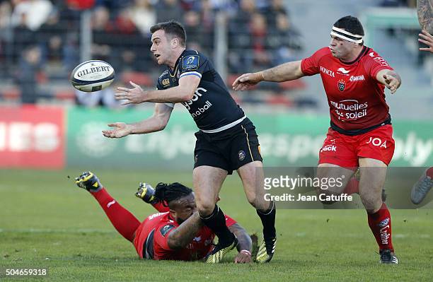 George Ford of Bath Rugby in action between Mathieu Bastareaud and Guilhem Guirado during the European Champions Cup match between Racing Club de...