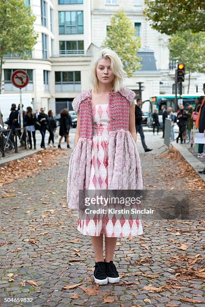 Student Messelier Aurelie wears a Freedom Girls dress and jacket and Asos trainers on day 9 during Paris Fashion Week Spring/Summer 2016/17 on...