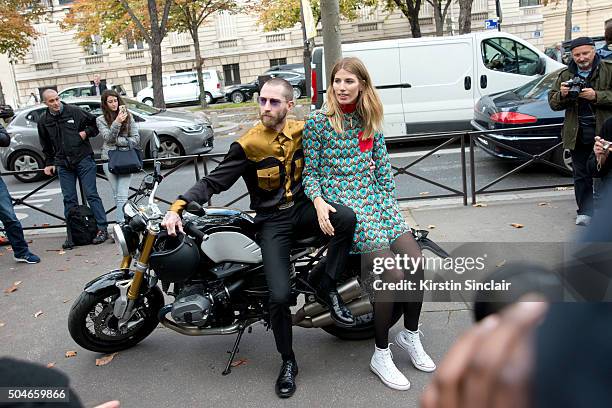 Fashion Buying director for MyTheresa.com Justin O'Shea with Style Editor for Harpers Bazaar Germany Veronika Heilbrunner who wears a Miu Miu dress...