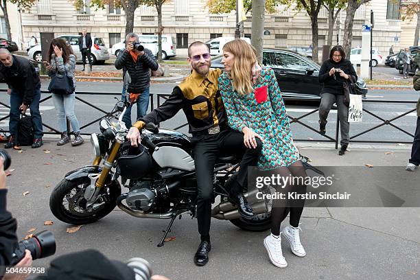 Fashion Buying director for MyTheresa.com Justin O'Shea with Style Editor for Harpers Bazaar Germany Veronika Heilbrunner who wears a Miu Miu dress...