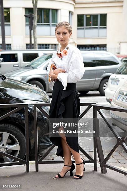 Fashion Illustrastrator Jenny Walton wears a vintage shirt and bag, Balenciaga skirt and Miu Miu shoes on day 9 during Paris Fashion Week...