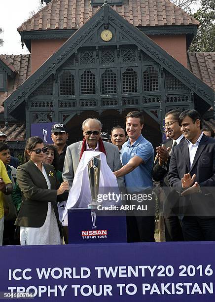 Pakistan Super League chairman Najam Sethi unveils the ICC 2016 World Twenty20 trophy during a ceremony in Lahore on January 12, 2016. The...