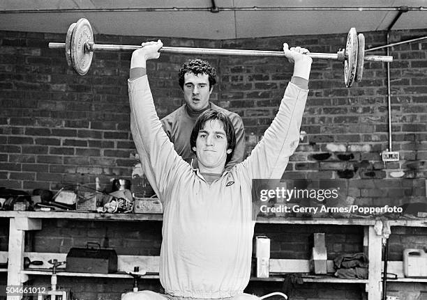 The groundsman's workshop provides a makeshift weights room with Aston Villa defender Chris Nicholl working out watched by John Burridge as bad...