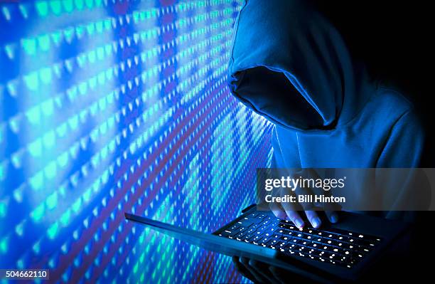 blue computer hacker - computer crime stock pictures, royalty-free photos & images