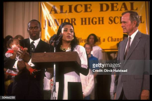Pres. Bush w. Track star Flo Jo Griffith Joyner, husband Al Joyner & baby Mary, paying call at Alice Deal Jr. HS.