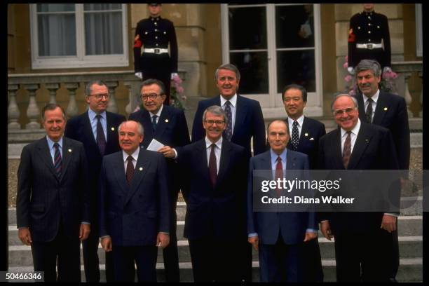 Soviet ldr. Gorbachev posing w. Group of 7 ldrs. Lubbers, Kohl, Kaifu, Mitterrand, Mulroney, Major, Andreotti, Delors & Bush.