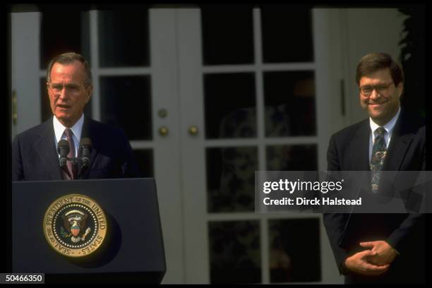 Dep. Atty. Gen. William Barr listening to Pres. Bush announce his nomination to succeed Atty. Gen. Thornburgh, framed by WH portico.