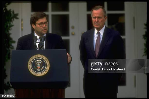 Pres. Bush listening to Dep. Atty. Gen. William Barr at WH portico ceremony announcing Dep.'s nomination to succeed Atty. Gen. Thornburgh.