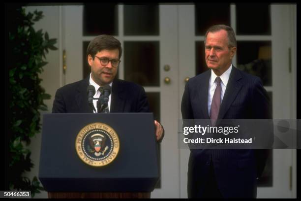 Pres. Bush listening to Dep. Atty. Gen. William Barr at WH portico ceremony announcing Dep.'s nomination to succeed Atty. Gen. Thornburgh.