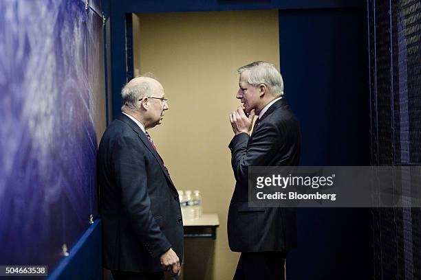 Jacob Frenkel, chairman of JPMorgan Chase International, left, speaks with Christian Noyer, former governor of the Bank of France, during a Banque de...