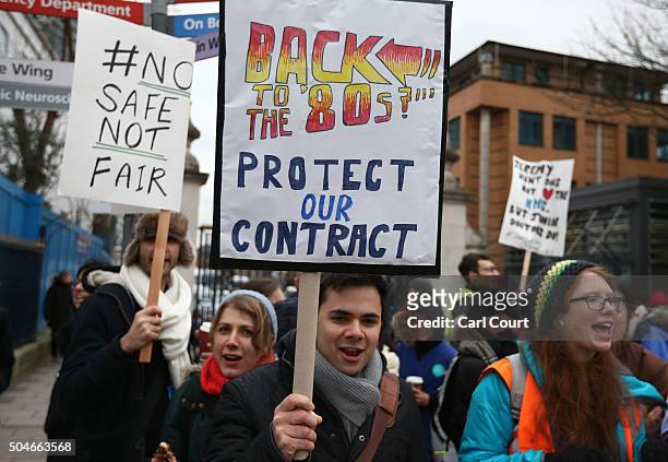 Junior doctor holds a poster as he takes part in a picket outside Kings College Hospital on January 12, 2016 in London, United Kingdom. Junior...