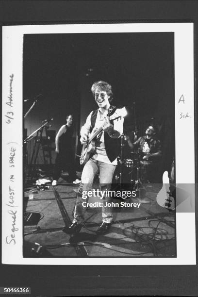 Ex-child actor, rock musician Bill Mumy playing guitar w. Several members of one of the bands he fronts during rehearsal.