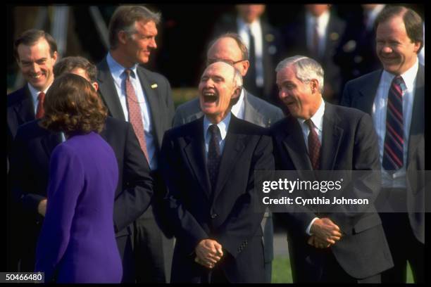 Adviser Brent Scowcroft laughing it up w. His dep. Bob Gates & other WH men, appearing to be commenting on passing woman in body-hugging dress.