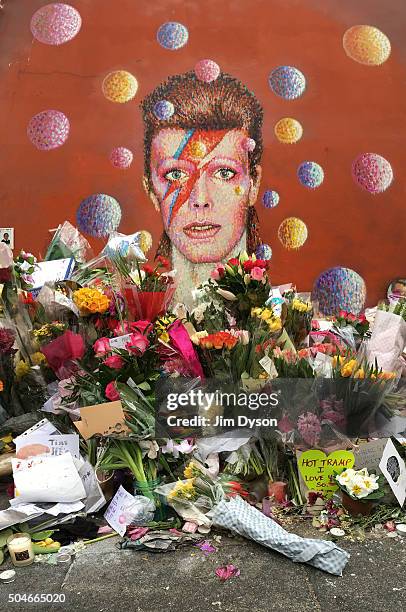 Tributes are paid to the late David Bowie at a mural in South London, on January 12, 2016 in London, England. British music and fashion icon David...