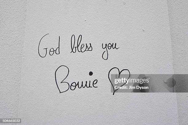 Tributes are paid to the late David Bowie at a mural in South London, on January 12, 2016 in London, England. British music and fashion icon David...