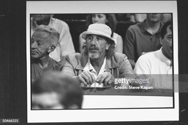 Record producer Lou Adler sitting in the stands w. Other fans at NBA basketball championship game between the Chicago Bulls & the L.A. Lakers at...