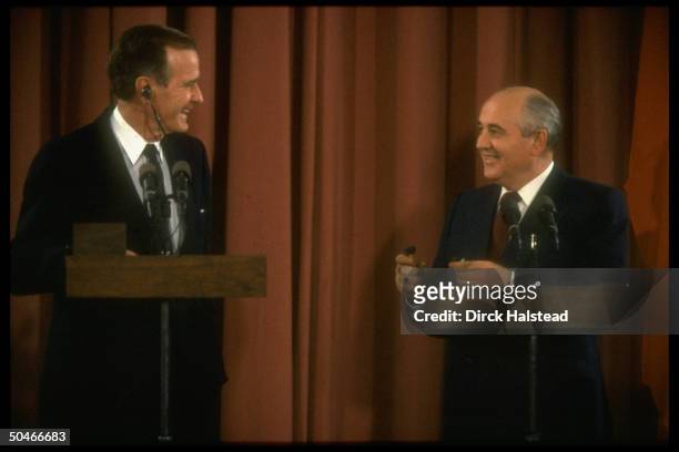 Presidents Gorbachev of USSR & Bush holding joint press conf., all smiles, during mtgs. Before opening Mideast peace conf.