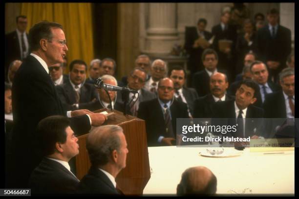 Pres. Bush speaking at Mid-east peace conf., w. Egypt's Moussa , Israel's Netanyahu & Jim Baker & USSR's Pankin .