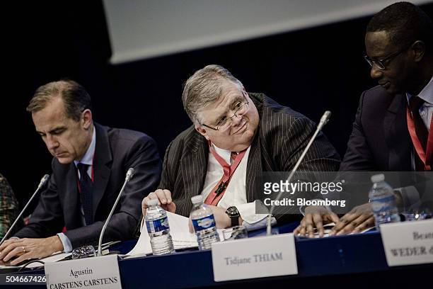 Mark Carney, governor of the Bank of England , left, Agustin Carstens, governor of the bank of Mexico, center, and Tidjane Thiam, chief executive...
