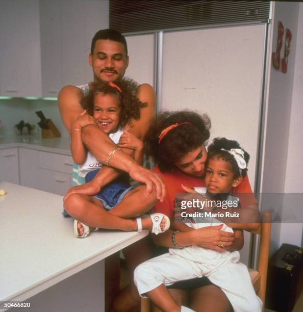 Self-made millionaire carpet store owner Fernando Mateo w. Wife Stella & daughters Megan & Hennessy at home, re his program teaching carpet laying to...