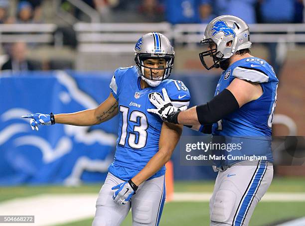 Jones of the Detroit Lions celebrates with teammate Travis Swanson after scoring his first NFL touchdown during the game against the San Francisco...