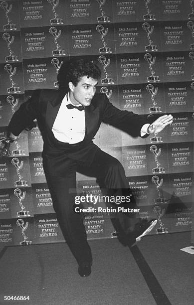 Actor Rick Hearst w. Award in hand dashing off to see new-born son Nicholas Charles at 18th Annual Daytime Emmy Awards.