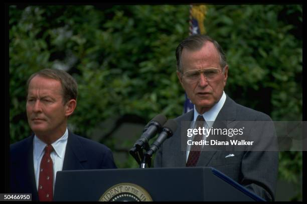 Pres. Bush speaking, w. Education Secy. Lamar Alexander by his side, in WH Rose Garden.