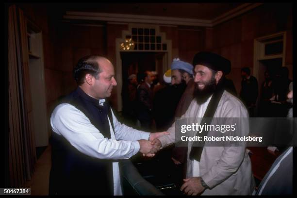 Mian Nawaz Sharif shaking hands w. Afghan Hezb-i-Islami's Gulbuddin Hekmatyar during mtg. W. Mujahedin ldrs.