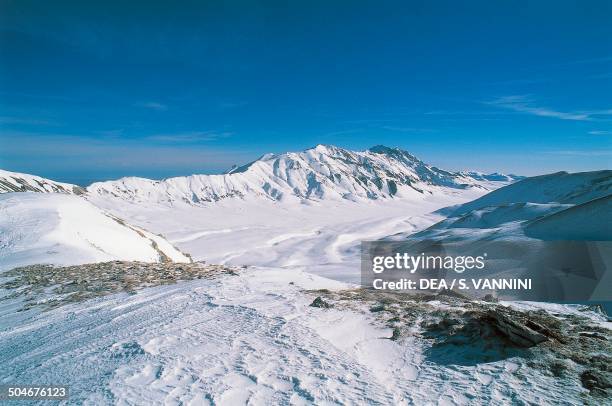 View of Monte Prena and Monte Camicia from Campo Imperatore with snow, Gran Sasso and Monti della Laga National Park, Abruzzo, Italy.