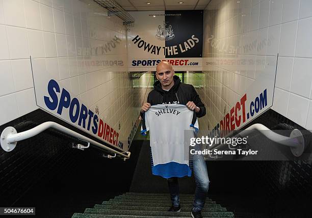 Newcastle's second January signing Jonjo Shelvey poses for photographs in the tunnel holding a Newcastle shirt with his name on the back at St.James'...