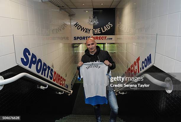 Newcastle's second January signing Jonjo Shelvey poses for photographs in the tunnel holding a Newcastle shirt with his name on the back at St.James'...