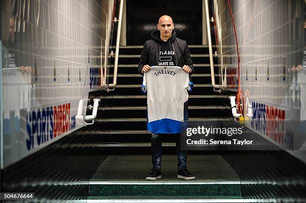 Newcastle's second January signing Jonjo Shelvey poses for photographs in the tunnel holding a Newcastle shirt with his name on the back at St.James'...