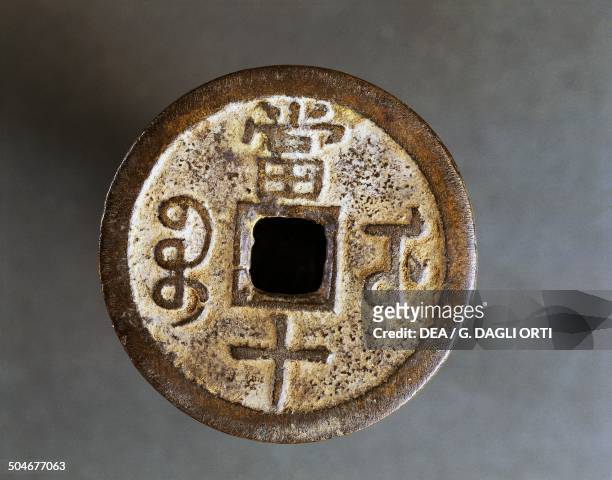 Wu Zhu bronze coin with central square hole . China, 118 BC-618 AD.
