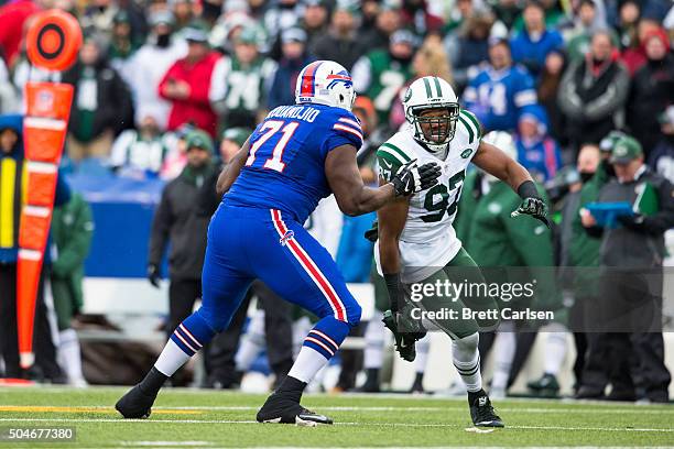 Cyrus Kouandjio of the Buffalo Bills blocks Calvin Pace of the New York Jets during the game on January 3, 2016 at Ralph Wilson Stadium in Orchard...