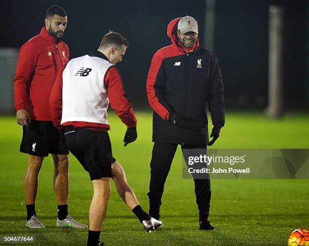 Jurgen Klopp manager of Liverpool talks with Steven Caulker and Brad Smith during a training session at Melwood Training Ground on January 12, 2016...