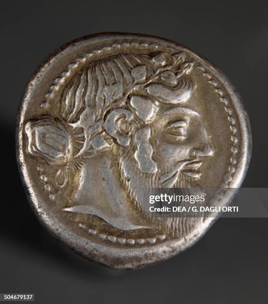 Athenian silver tetradrachm with head of Dionysus, 461-430 BC, from Naxos . Ancient Greek coins, 5th century BC.