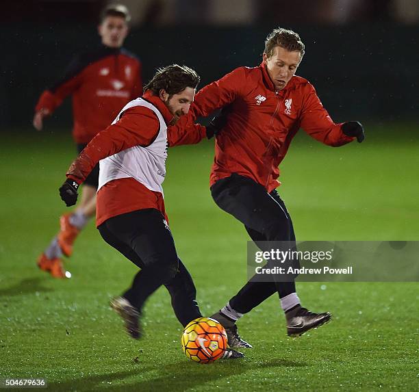 Joe Allen and Lucas Leiva of Liverpool in action during a training session at Melwood Training Ground on January 12, 2016 in Liverpool, England.