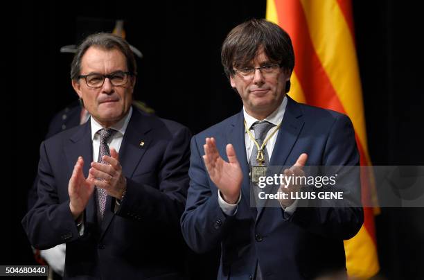 Outgoing President of the Catalan Government and leader of the Catalan Democratic Convergence Artur Mas and new elected President of the Catalan...