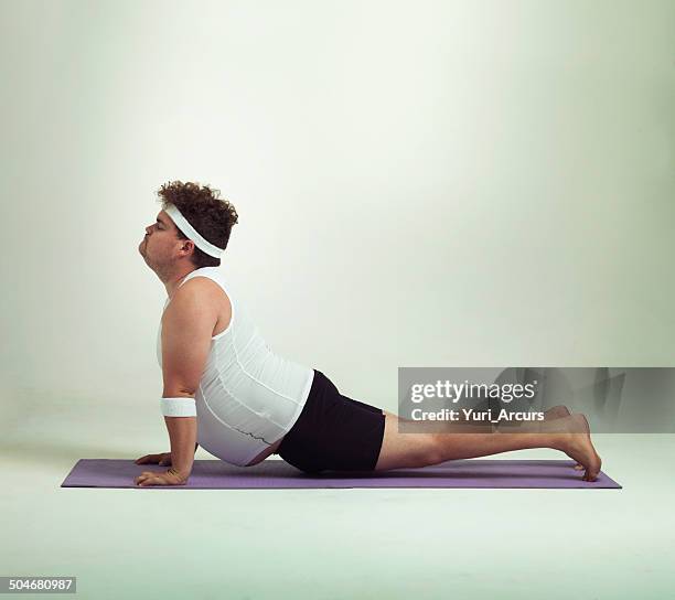 this upward facing dog pose is great - funny man stock pictures, royalty-free photos & images