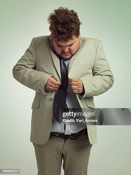 how is this done? - fat man in suit stock pictures, royalty-free photos & images