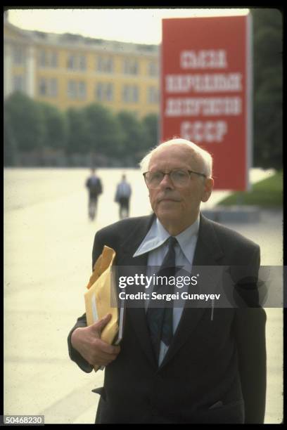 Human rights activist Andrei Sakharov, dissident-turned-dep., outside, framed by CCCP sign, during 1st Congress of People's Deputies.