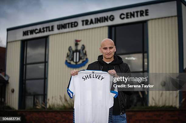 Newcastle's second January signing Jonjo Shelvey poses for photographs holding a Newcastle Shirt with his name on the back at The Newcastle United...