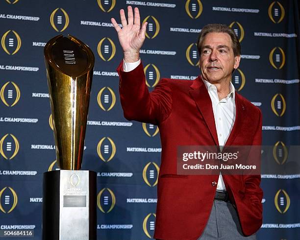 Head Coach Nick Saban of the Alabama Crimson Tide pose with the College Football Playoff National Championship Trophy during the MVP Press Conference...